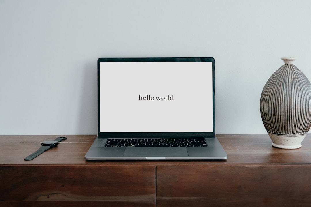 An image of laptop displaying "Hello World" message