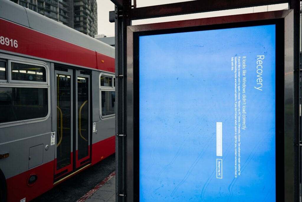 A bus stop with a Windows blue screen of death