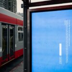 A bus stop with a Windows blue screen of death